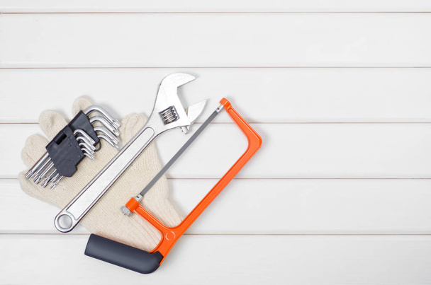 Tools on a white wooden background - Foto, imagen