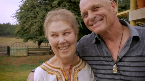 Authentic moment between a senior couple laughing and smiling - Footage, Video