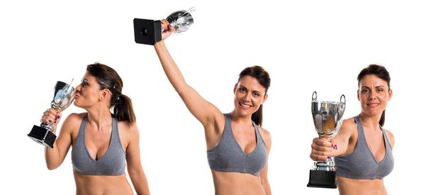 Sport woman holding a trophy - Foto, immagini