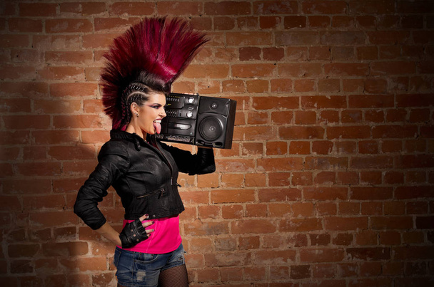 Punk girl on brick wall background - Фото, зображення