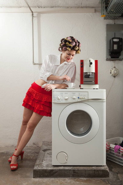 woman in laundry, interior - Фото, изображение