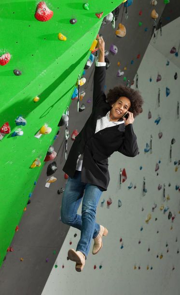 woman on artificial climbing wall  - Photo, image