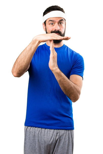 Funny sportsman making time out gesture on isolated white backgr - Photo, image