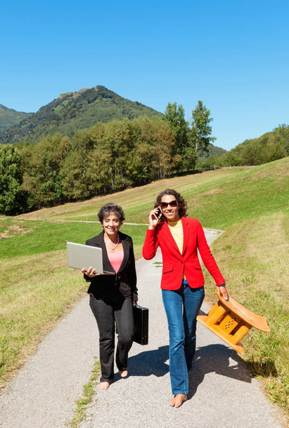 two business women in the countryside, outdoors - Фото, зображення