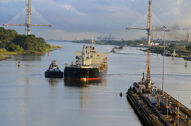 Westbound container ship being guided into position to enter Gatun Locks on the Panama Canal. - Photo, Image