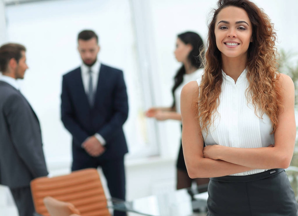 beautiful woman on the background of business people. - Photo, Image