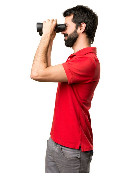 Handsome man with binoculars - Foto, imagen
