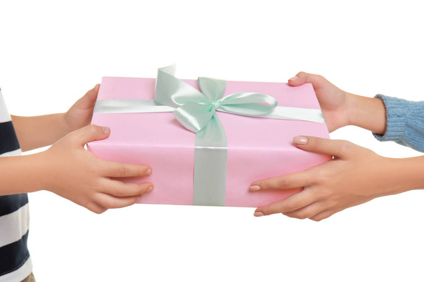 Young woman receiving Mother's Day gift from her little son on white background, closeup - Photo, image