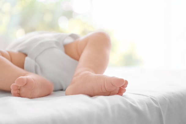 Cute baby lying on bed at home - Photo, Image