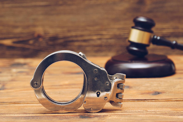 Judge gavel and handcuffs. Law concept photo - Φωτογραφία, εικόνα