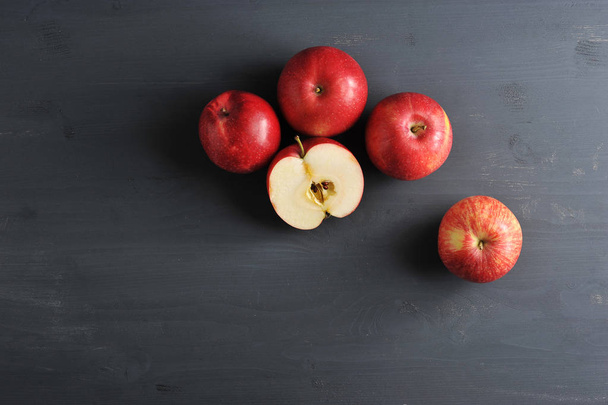 red ripe apples on a dark rustic wooden background - Photo, image