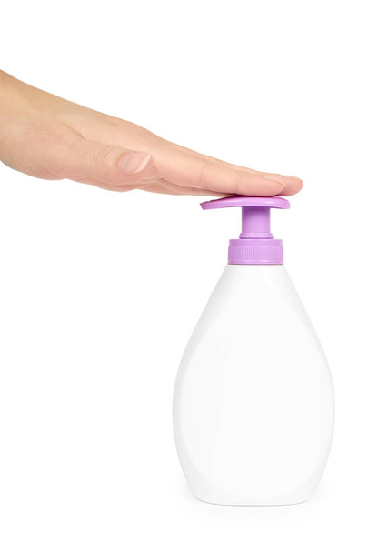 White hand sanitizer soap dispenser in hand isolated on white background. Housework and sanitary concept - Fotoğraf, Görsel