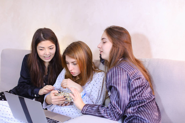 Friendly female friends cool spend time watching movies on lapto - Photo, Image