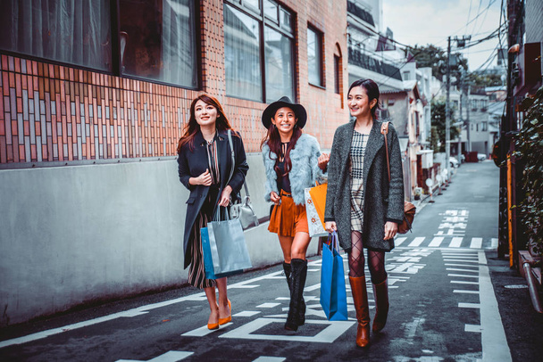 Group of japanese women spending time in Tokyo, making shopping  - Photo, Image