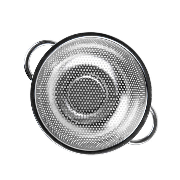 A small metal colander on a white isolated background. Kitchen accessories. - Photo, Image