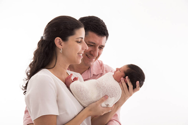 Happy family with newborn baby on a white background. - Photo, Image