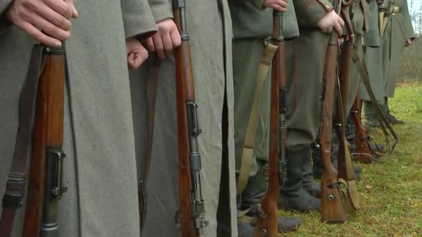 German soldiers of the old Kaiser's army standing in the ranks, holding rifles in their hands,helmets fastened to belts. Reconstruction of the First World War of 1914-1918, general plan. - Footage, Video