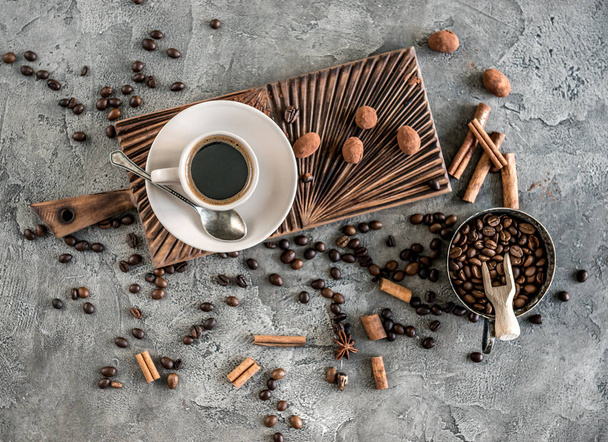 Black coffee with candies on a concrete background top view - Fotoğraf, Görsel