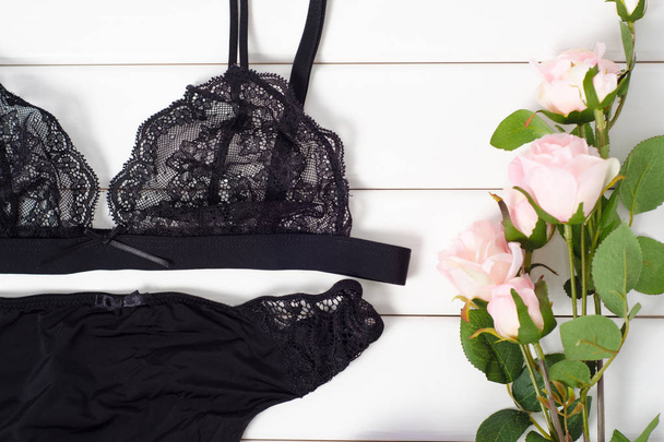 Black bra panties perfume flowers - Zdjęcie, obraz
