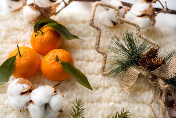 Christmas decorations, knitted scarfs and cotton - Φωτογραφία, εικόνα