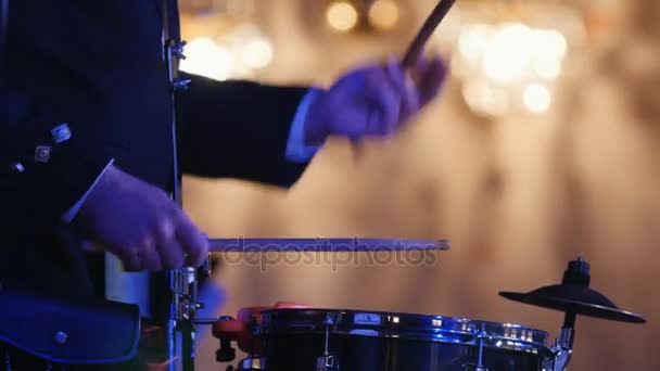 Drum performer plays drumstick at the stage - Footage, Video