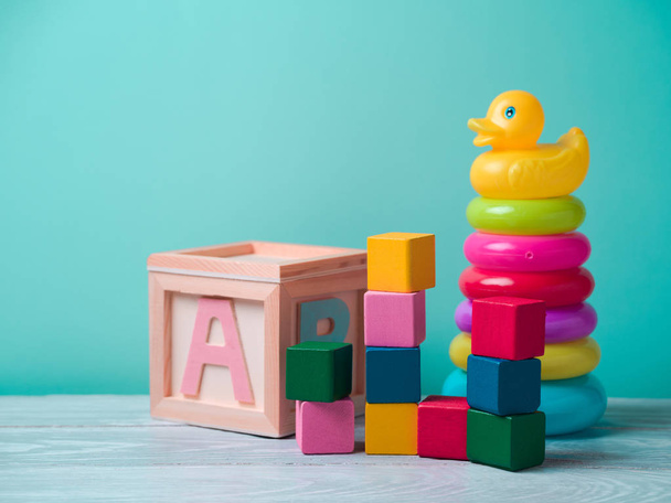 Baby toys on wooden table - Фото, изображение