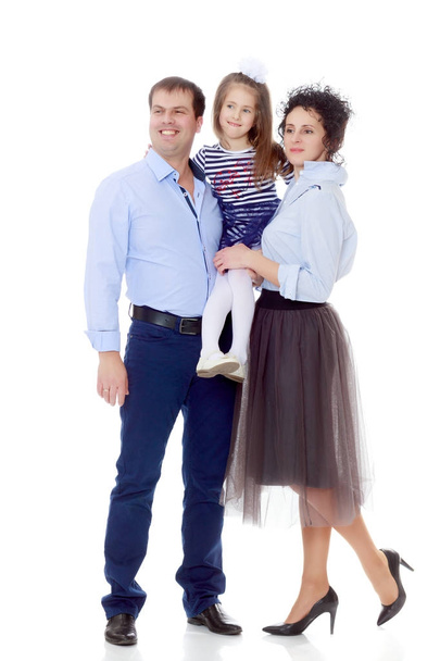 Happy parents with a small daughter. - Foto, imagen