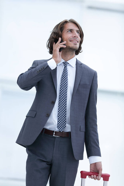 businessman with travel suitcase talking on the phone - Φωτογραφία, εικόνα
