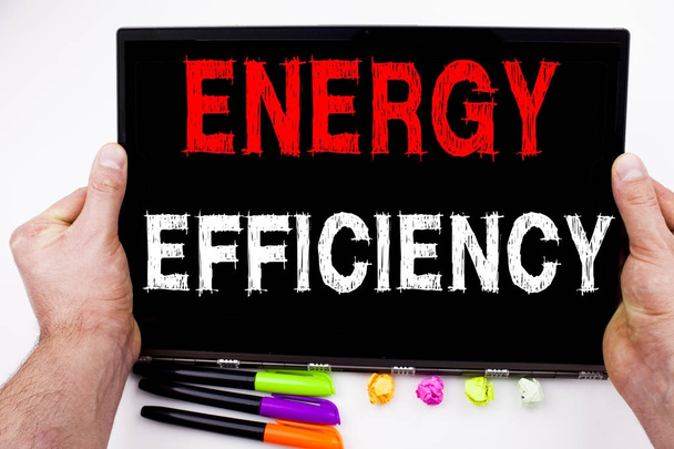 Writing showing Energy Efficiency made in the office with surroundings laptop marker pen. Business concept for Building Technology Efficiency Workshop white background with copy space - Foto, imagen