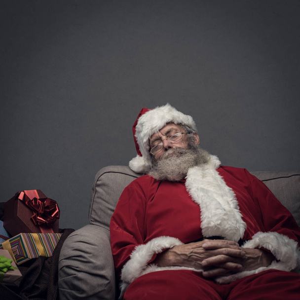 Santa Claus napping on the armchair - Photo, Image