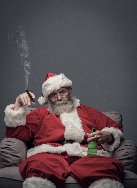 Bad Santa celebrating at home - Valokuva, kuva
