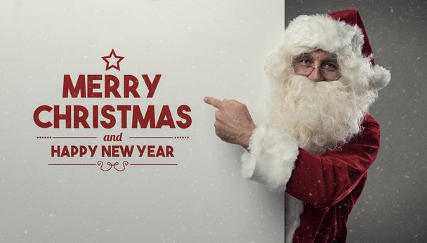 Santa Claus wishing you a Merry Christmas - Foto, afbeelding