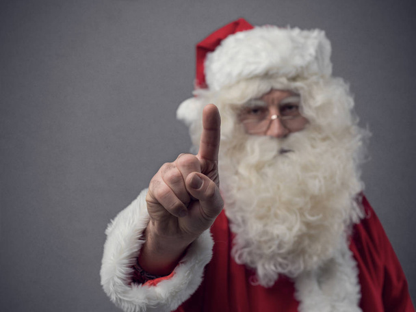 Santa Claus using a touch screen user interface - Fotografie, Obrázek