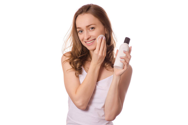 Beautiful young woman tonic micellar water gel for face washing cotton pads - Foto, imagen