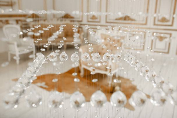 Closeup photo of chrystal chandelier. Glamour background with copy space. Luxury interior - Foto, Imagem