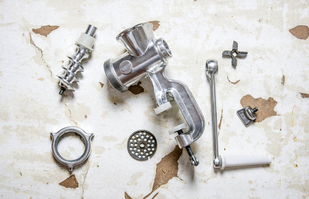 Disassembled manual grinder. On rustic background. - Photo, Image