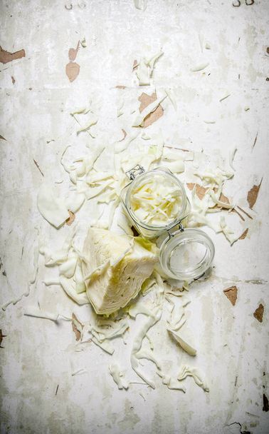 The chopped cabbage in a glass jar.  - Valokuva, kuva
