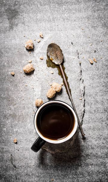 Hot black coffee with brown sugar.  - Photo, image