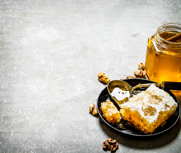 Honey background. Fresh honey and walnuts .  - 写真・画像