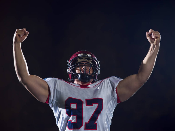 american football player celebrating after scoring a touchdown - Foto, Bild