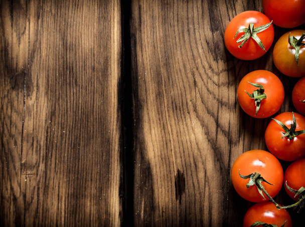 Fresh red tomatoes . On wooden background. - Photo, image