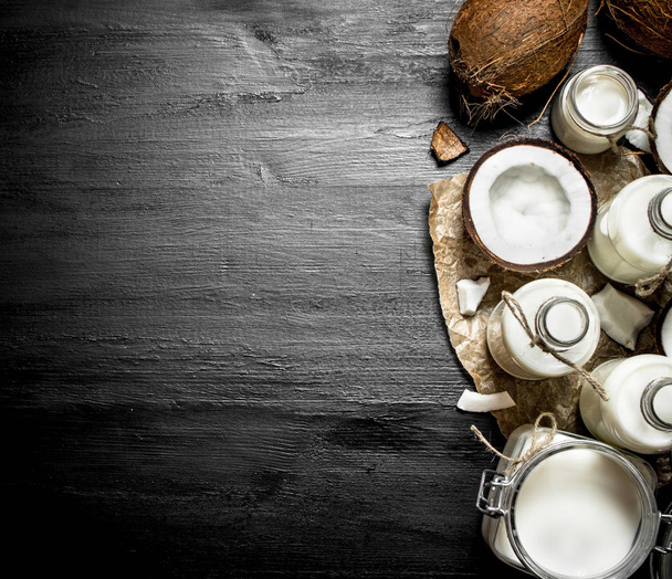 Coconut milk in bottles. - Foto, Imagen