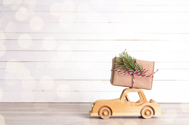 Christmas gift box on toy car with copy space. - Zdjęcie, obraz