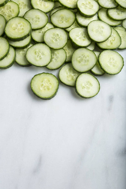 Closeup Healthy Cut Cucumber slices on white background - Foto, Imagem