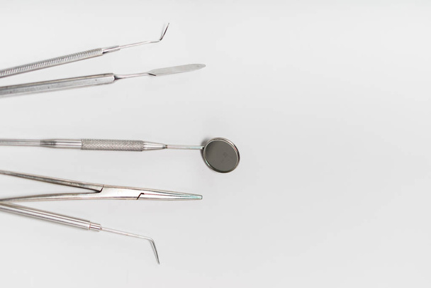 on a white background medical dental instruments lie - Valokuva, kuva