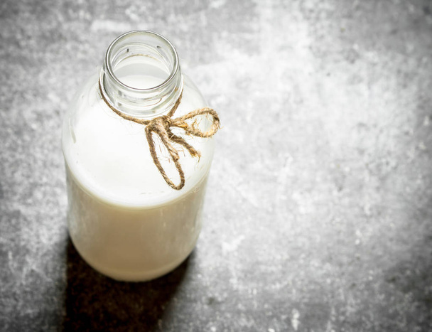 The milk in the bottle. - Photo, image