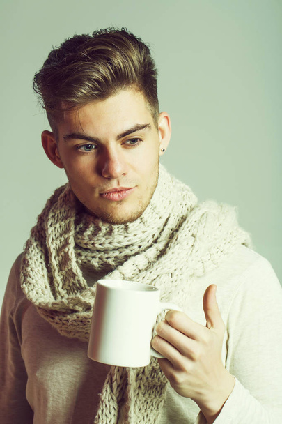 handsome guy with cup in scarf - Фото, зображення