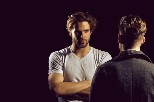 Two handsome men standing with faces opposite - Fotografie, Obrázek