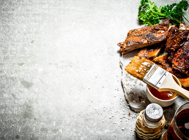 Smoked barbecue ribs with beer and herbs. - 写真・画像