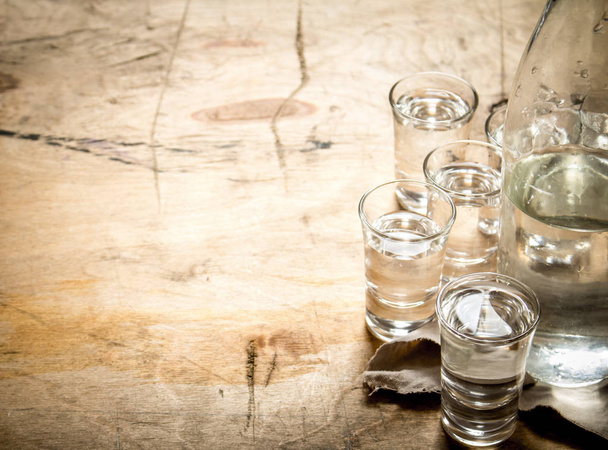 bottle of vodka with shot glasses. - Fotografie, Obrázek